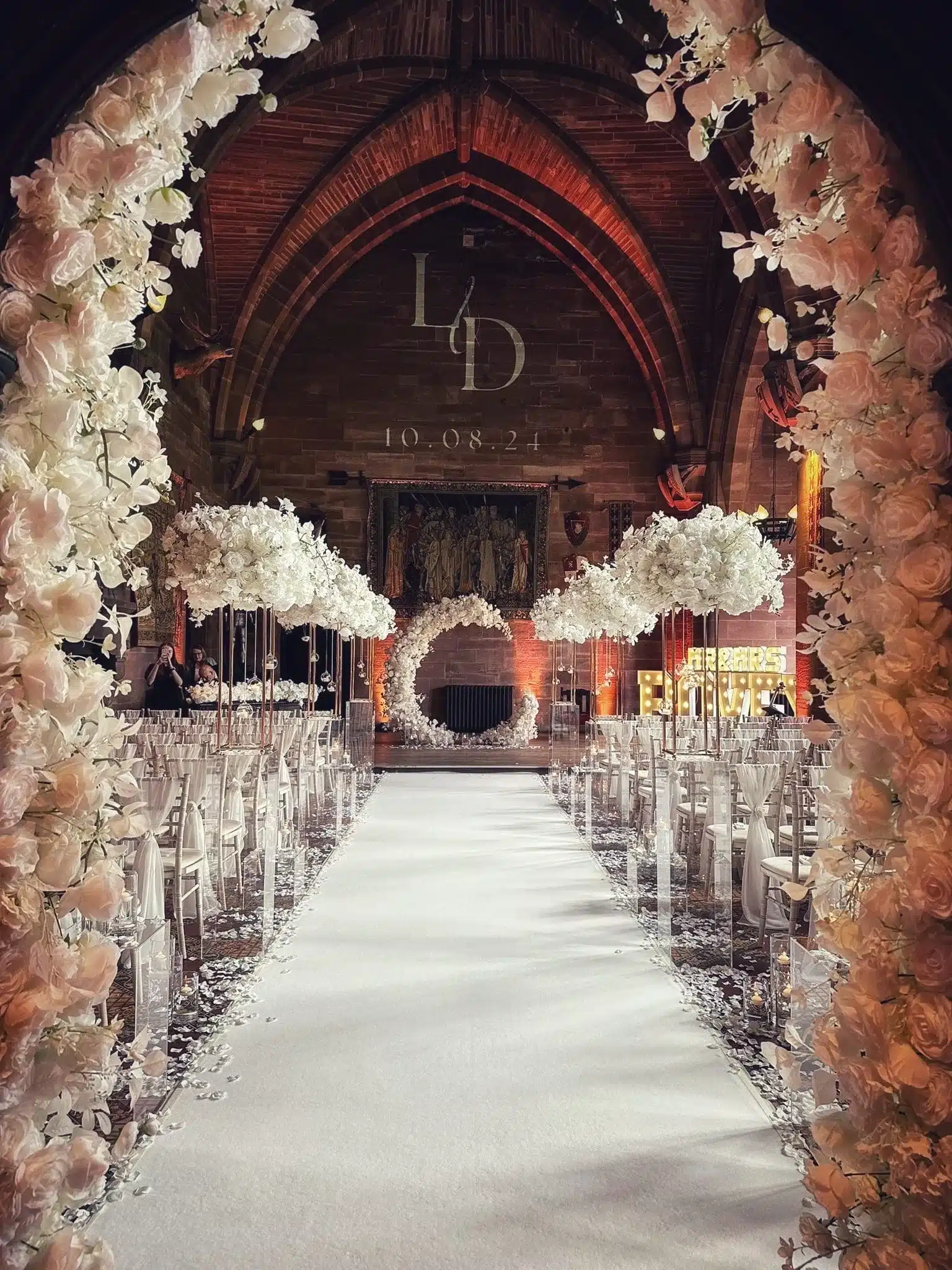 Wedding venue stylist cheshire create beautiful all white wedding venue styling at peckforton castle.